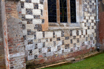 Flint and Totternhoe Stone chequerboard work on the east end of the church February 2010